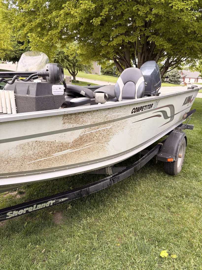 Before — aluminum boat hull streaked with algae and waterline stains