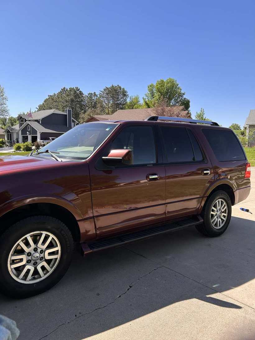 After — the same SUV washed, with gloss returned to the paint