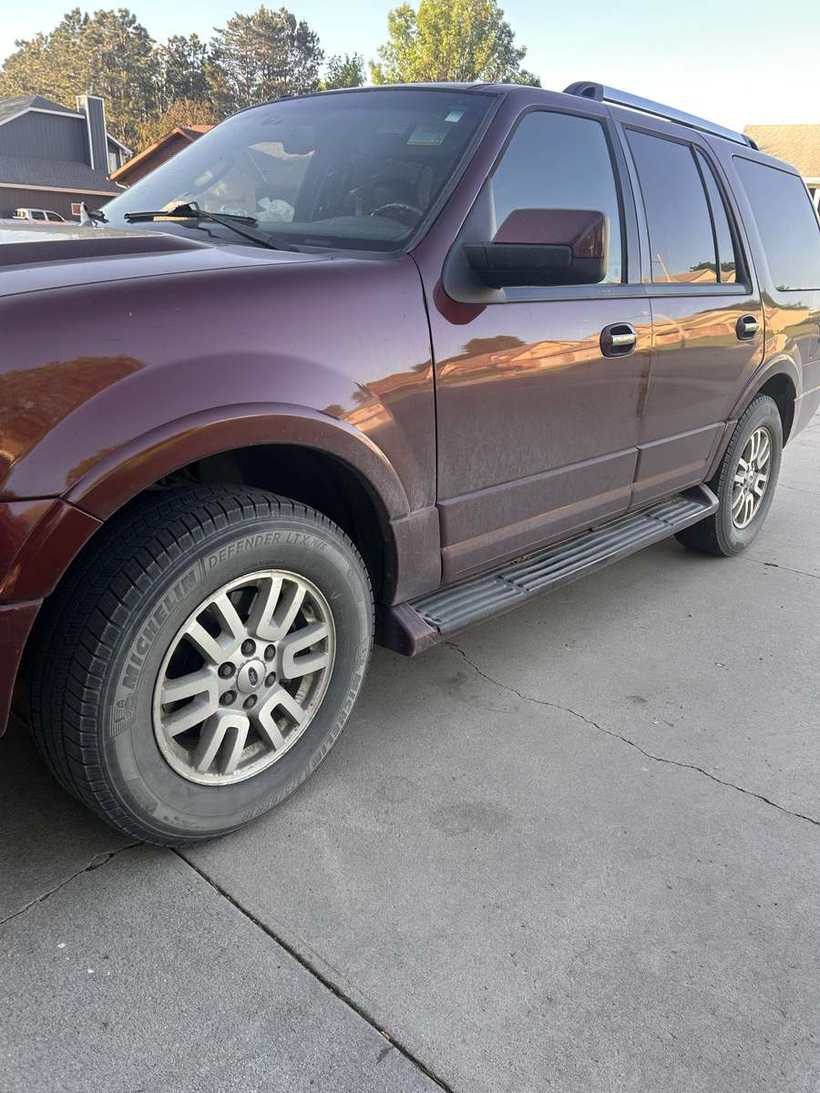 Before — a maroon SUV with dull, road-filmed paint