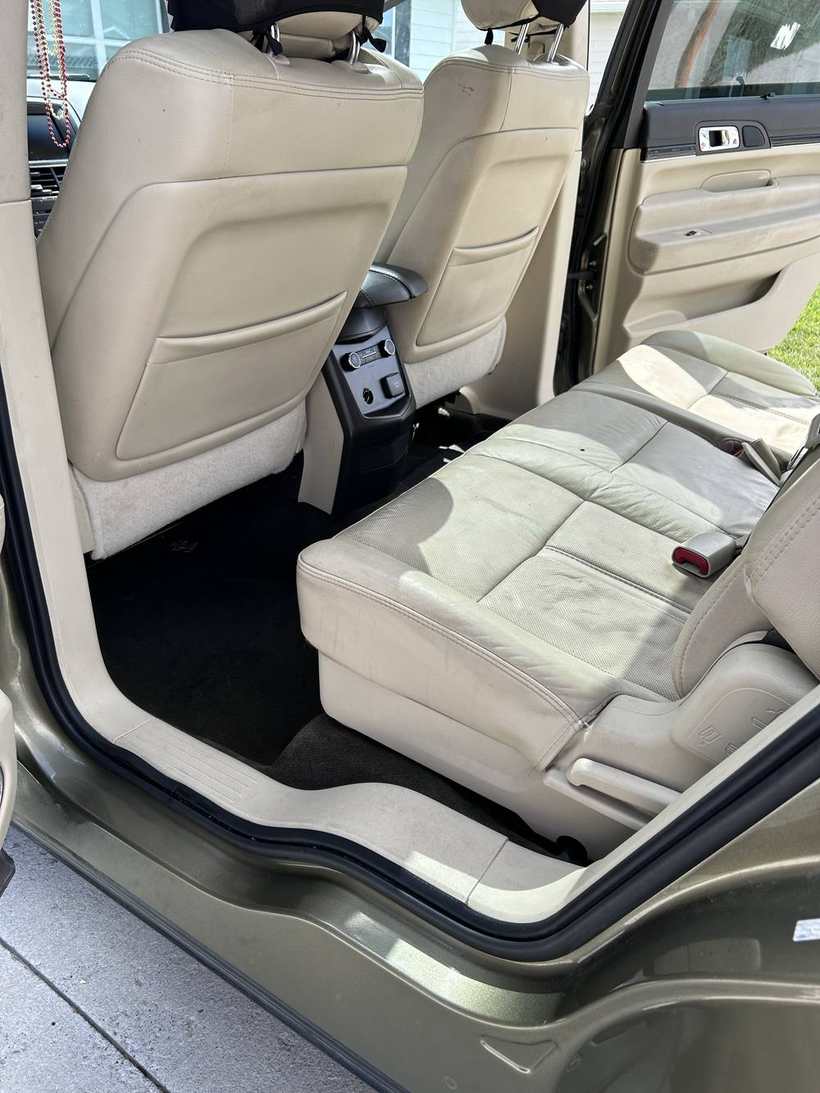 After — the same rear seats and floor, vacuumed and wiped down